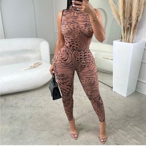 Mesh bodysuit with pants.